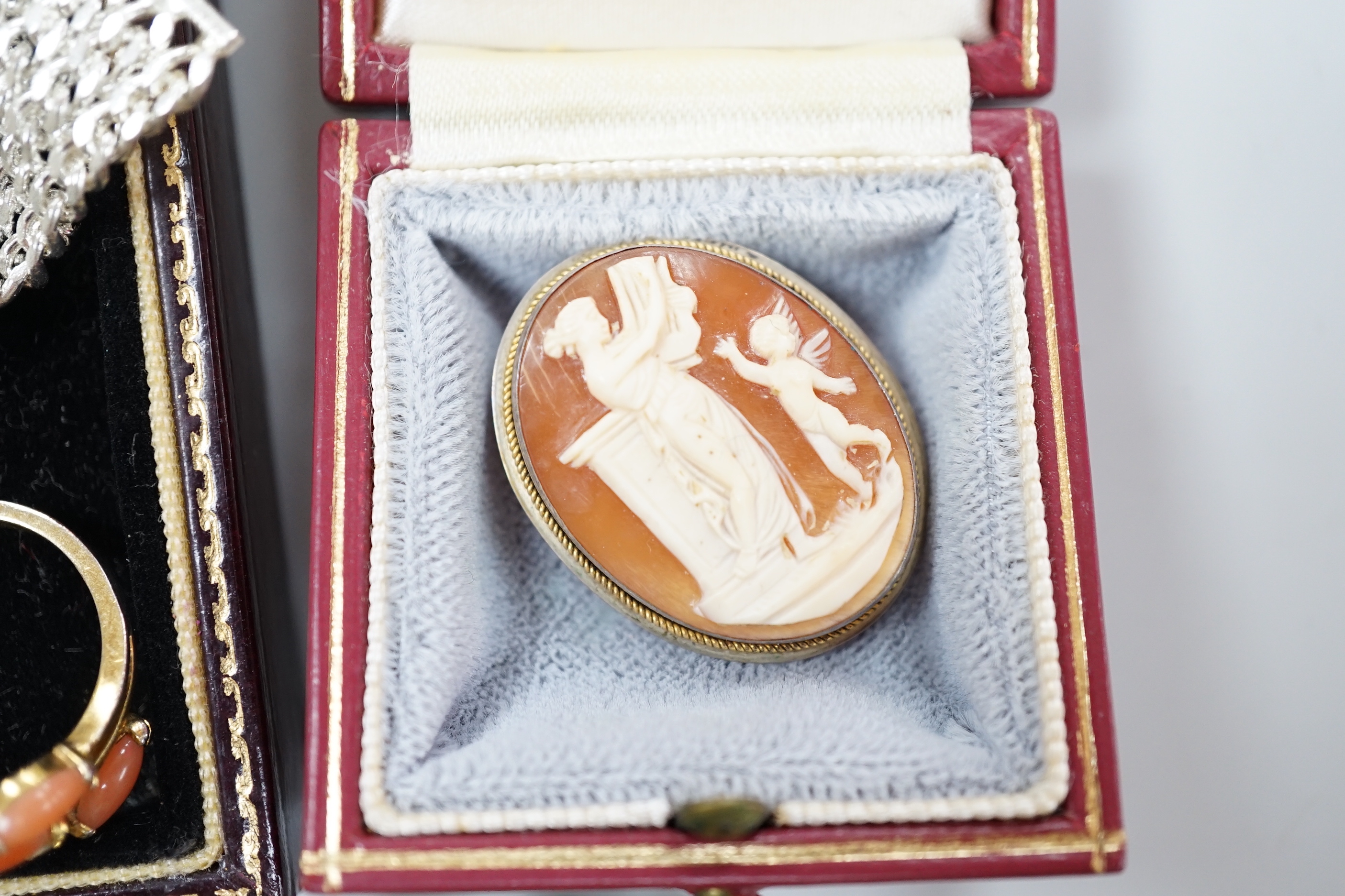 A group of assorted costume jewellery including a brooch in cameo corner leather case, and a small white card Cartier box